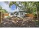 Fully fenced backyard with new privacy fence and mature trees at 1608 Carlos Ave, Clearwater, FL 33755