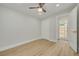 Bright bedroom with wood-look flooring and a closet at 1608 Carlos Ave, Clearwater, FL 33755