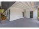 A spacious carport with a covered entry and neutral color scheme, designed for comfortable outdoor living at 1608 Carlos Ave, Clearwater, FL 33755