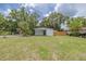 Charming single-story home with front lawn and palm tree at 1608 Carlos Ave, Clearwater, FL 33755