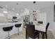 Open concept home design with kitchen island, dining table and view of the living room at 1608 Carlos Ave, Clearwater, FL 33755
