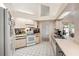 Functional kitchen with white appliances, tiled floors, ample counter space, and a bright and airy atmosphere at 1763 Pebble Hill Ct, Palm Harbor, FL 34683