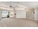 Neutral living room with plush carpeting, bright light, airy open floor plan, and access to outdoor pool at 1763 Pebble Hill Ct, Palm Harbor, FL 34683