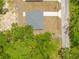 A straight-down aerial view shows a new roof and newly laid grass at 19267 Wildwood Dr, Brooksville, FL 34601