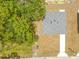 An aerial view showing the roof of the house and newly planted grass at 19267 Wildwood Dr, Brooksville, FL 34601