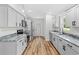 Modern kitchen featuring gray cabinets, granite countertops, and stainless steel appliances at 19267 Wildwood Dr, Brooksville, FL 34601