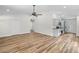 Open living space featuring stylish flooring, recessed lighting, and seamless access to the kitchen at 19267 Wildwood Dr, Brooksville, FL 34601
