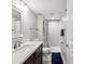 Clean bathroom with large mirror and walk-in shower at 214 Meadow Ln # 214, Oldsmar, FL 34677