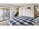 Comfortable bedroom boasts sliding doors and natural light at 214 Meadow Ln # 214, Oldsmar, FL 34677