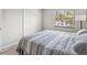 This bedroom boasts a serene atmosphere with natural light and a spacious closet at 214 Meadow Ln # 214, Oldsmar, FL 34677