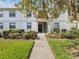 Charming condo building with well-maintained landscaping and inviting walkway at 214 Meadow Ln # 214, Oldsmar, FL 34677