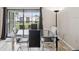 Light dining room with glass table, seating for six, and view of outdoor area at 214 Meadow Ln # 214, Oldsmar, FL 34677