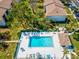 Aerial view of community pool with chairs and umbrellas at 214 Meadow Ln # 214, Oldsmar, FL 34677