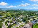 Aerial view of the home and neighborhood, showcasing nearby waterways and lush landscape at 218 N Bay Hills Blvd, Safety Harbor, FL 34695