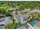 Aerial view of home with pool, patio, and lush landscaping, near a pond at 218 N Bay Hills Blvd, Safety Harbor, FL 34695