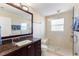 Elegant bathroom featuring granite countertop, glass shower, and modern fixtures at 218 N Bay Hills Blvd, Safety Harbor, FL 34695