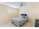 Bedroom with nautical decor, a ceiling fan, and soft lighting at 218 N Bay Hills Blvd, Safety Harbor, FL 34695