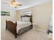 Cozy bedroom featuring a wood-frame bed and calm décor at 218 N Bay Hills Blvd, Safety Harbor, FL 34695