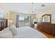 Stylish bedroom with hardwood floors, chandelier, and large window with natural light at 218 N Bay Hills Blvd, Safety Harbor, FL 34695