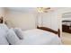 Comfortable bedroom with ceiling fan, neutral walls, and a mirrored closet at 218 N Bay Hills Blvd, Safety Harbor, FL 34695
