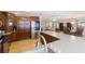 Open concept kitchen with wood cabinets, stainless steel appliances, and an island overlooking the living and dining areas at 218 N Bay Hills Blvd, Safety Harbor, FL 34695