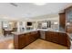 A view of the open kitchen featuring sleek appliances, ample cabinetry, and an island prep space at 218 N Bay Hills Blvd, Safety Harbor, FL 34695