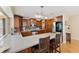 Bright kitchen with wood cabinets, stainless steel appliances, and an island with seating, perfect for casual dining at 218 N Bay Hills Blvd, Safety Harbor, FL 34695