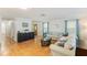 Comfortable living room with neutral tones, hardwood flooring, and plenty of natural light at 218 N Bay Hills Blvd, Safety Harbor, FL 34695
