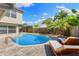 Beautiful pool area features a well-maintained pool, brick patio, and lovely lounge seating at 218 N Bay Hills Blvd, Safety Harbor, FL 34695