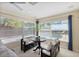 Sunroom with bench seating overlooking the pool area at 218 N Bay Hills Blvd, Safety Harbor, FL 34695
