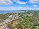 Scenic aerial view of a city skyline with bay views, lush trees, and a major highway at 2404 W Jetton Ave, Tampa, FL 33629