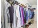 Walk-in closet with hanging clothes, shelving, and organization system at 2404 W Jetton Ave, Tampa, FL 33629