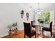 Bright dining room with hardwood floors, unique decor, and a window bringing in natural light at 2404 W Jetton Ave, Tampa, FL 33629