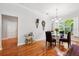 Bright dining room with hardwood floors, unique decor, and a window bringing in natural light at 2404 W Jetton Ave, Tampa, FL 33629