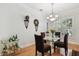 Stylish dining room with modern table, chandelier, and bar cart at 2404 W Jetton Ave, Tampa, FL 33629