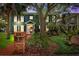 Charming two-story home with brick mailbox, lush landscaping, and a welcoming front porch at 2404 W Jetton Ave, Tampa, FL 33629