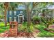 Charming two-story home with lush landscaping, brick accents and a welcoming front entrance at 2404 W Jetton Ave, Tampa, FL 33629