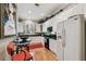 Bright kitchen with white cabinets, black countertops, and modern appliances at 2404 W Jetton Ave, Tampa, FL 33629