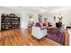 Comfortable living area with hardwood floors, bright lighting, and stylish furniture at 2404 W Jetton Ave, Tampa, FL 33629