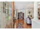 Elegant living room featuring hardwood floors, a bookshelf, and abundant natural light at 2404 W Jetton Ave, Tampa, FL 33629