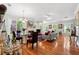 Sunlit living room with hardwood floors, fireplace, and dining area for easy entertaining at 2404 W Jetton Ave, Tampa, FL 33629