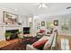 Spacious living area with hardwood floors, fireplace, and large windows at 2404 W Jetton Ave, Tampa, FL 33629