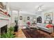 Cozy living area features a fireplace, wood floors, and comfortable seating at 2404 W Jetton Ave, Tampa, FL 33629