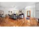 Open living space with hardwood floors, a fireplace, and stylish furnishings at 2404 W Jetton Ave, Tampa, FL 33629