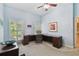 Spacious home office with neutral tones, ample desk space, and natural light from surrounding windows at 2404 W Jetton Ave, Tampa, FL 33629