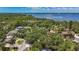 Aerial view of a wooded neighborhood near Tampa Bay and Philippe Park at 2439 Madrid Ave, Safety Harbor, FL 34695