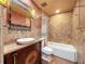 Stylish bathroom featuring a modern vessel sink, custom vanity and tiled shower-tub combination at 2439 Madrid Ave, Safety Harbor, FL 34695