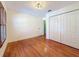 Bedroom featuring hardwood floors, a closet and natural light at 2439 Madrid Ave, Safety Harbor, FL 34695