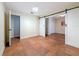 Bedroom showcasing tile flooring and sliding barn doors at 2439 Madrid Ave, Safety Harbor, FL 34695