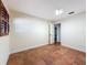 Bedroom showcasing tile flooring and a window at 2439 Madrid Ave, Safety Harbor, FL 34695